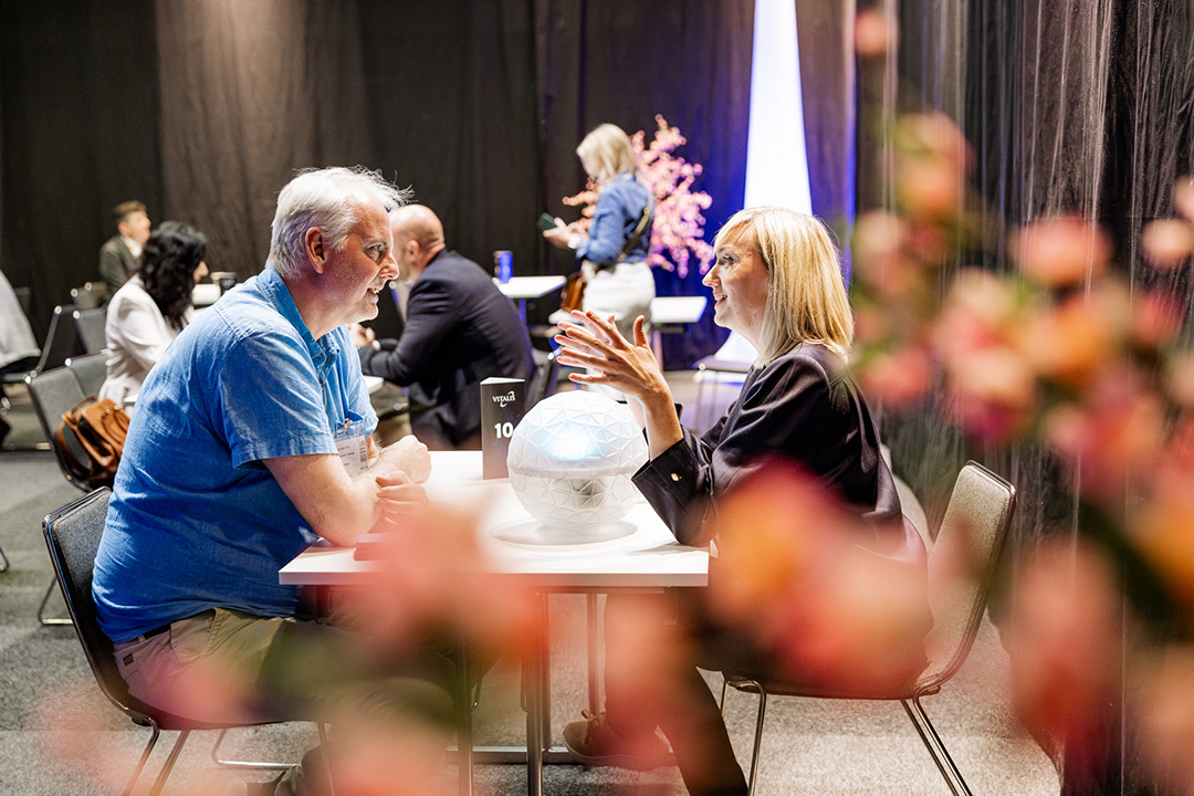 Two people at a table networking