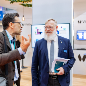 Sales Manager showing a new exhibitor around at the fair