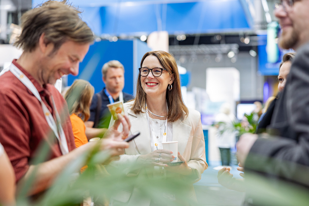 Three perople networking in the exhibition