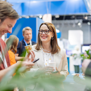 Three perople networking in the exhibition